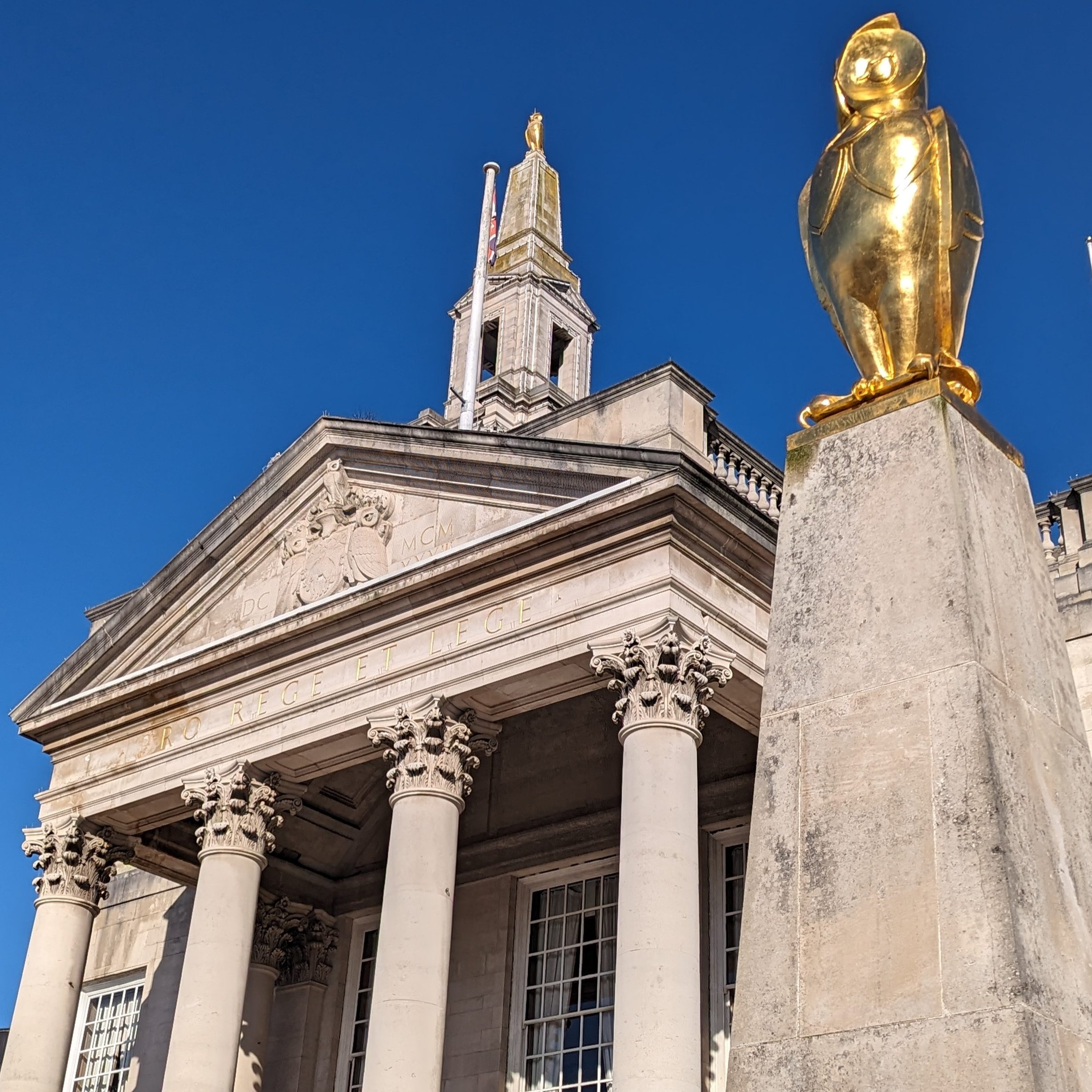 Leeds Civic Hall with a golden owl in the foreground